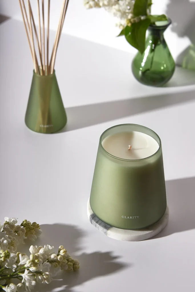 Clarity Home Fragrance candle and reed diffuser styled together in a sage-green palette
