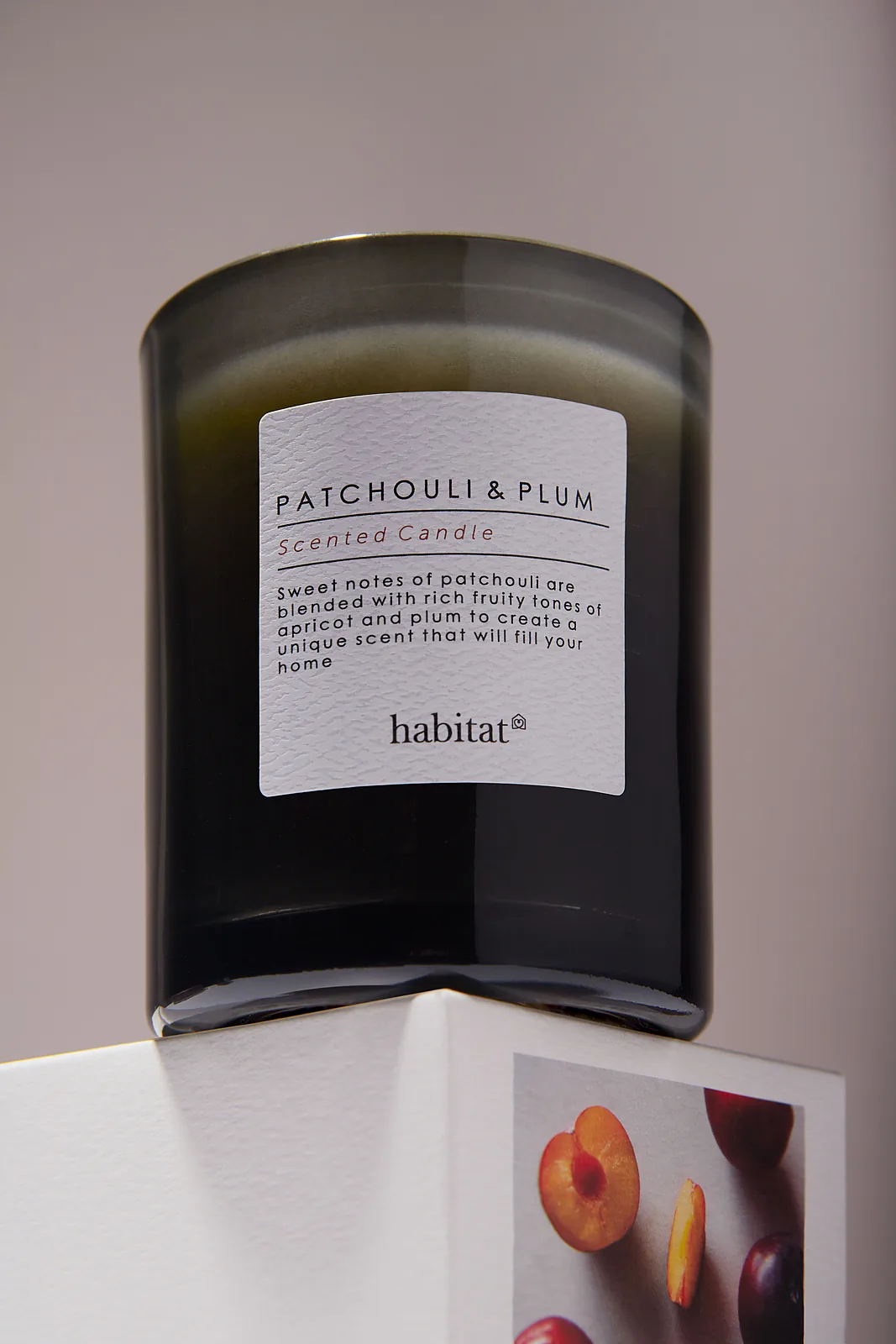 Macro product photography — candle label texture and glass detail