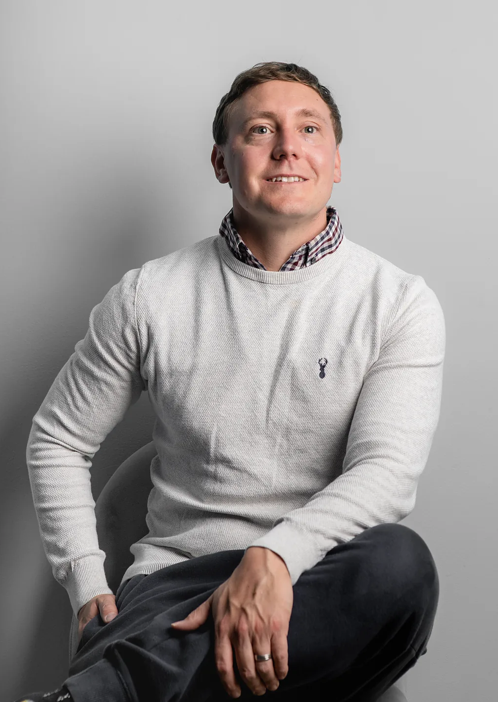 Corporate headshot photography in Oxfordshire — a confident LinkedIn-style profile portrait against a bright office backdrop.