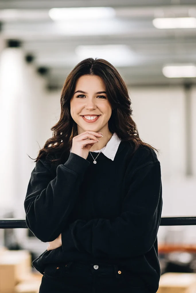 Corporate headshot photography in London — a confident LinkedIn-style profile portrait against a bright office backdrop.
