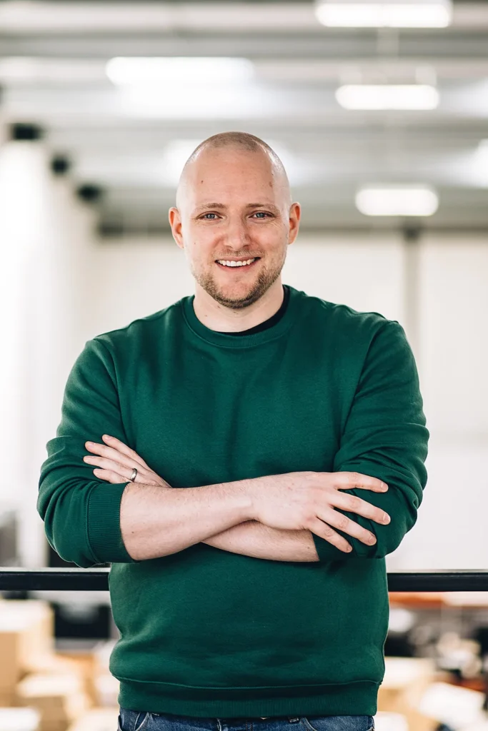 London corporate headshots: a warm, approachable team portrait shot in a modern workspace.